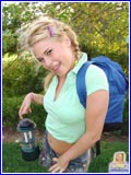 Blonde cutie Little Summer in pigtails outdoors